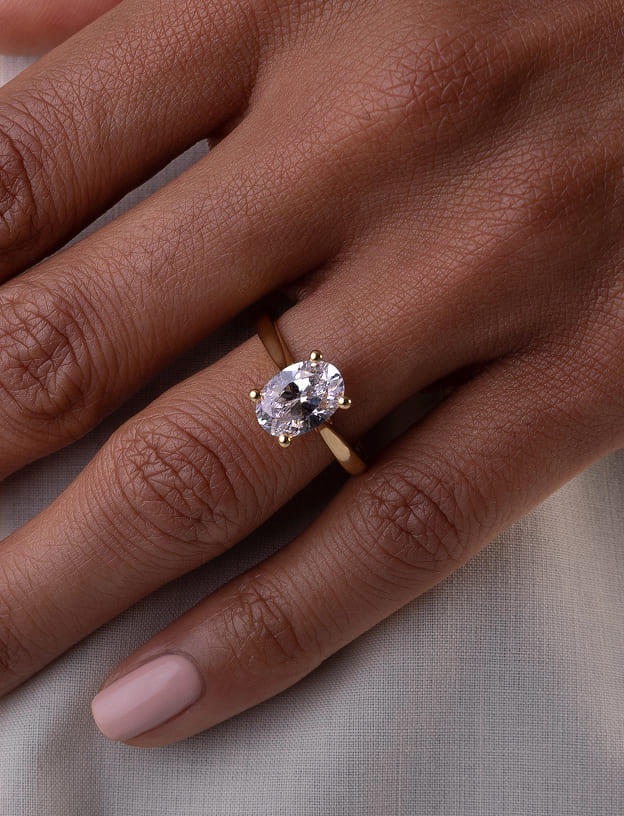 Oval diamond solitaire ring in yellow gold