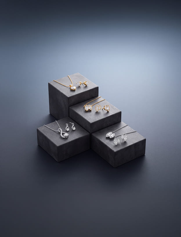 Diamond pendant and earring gift sets on display